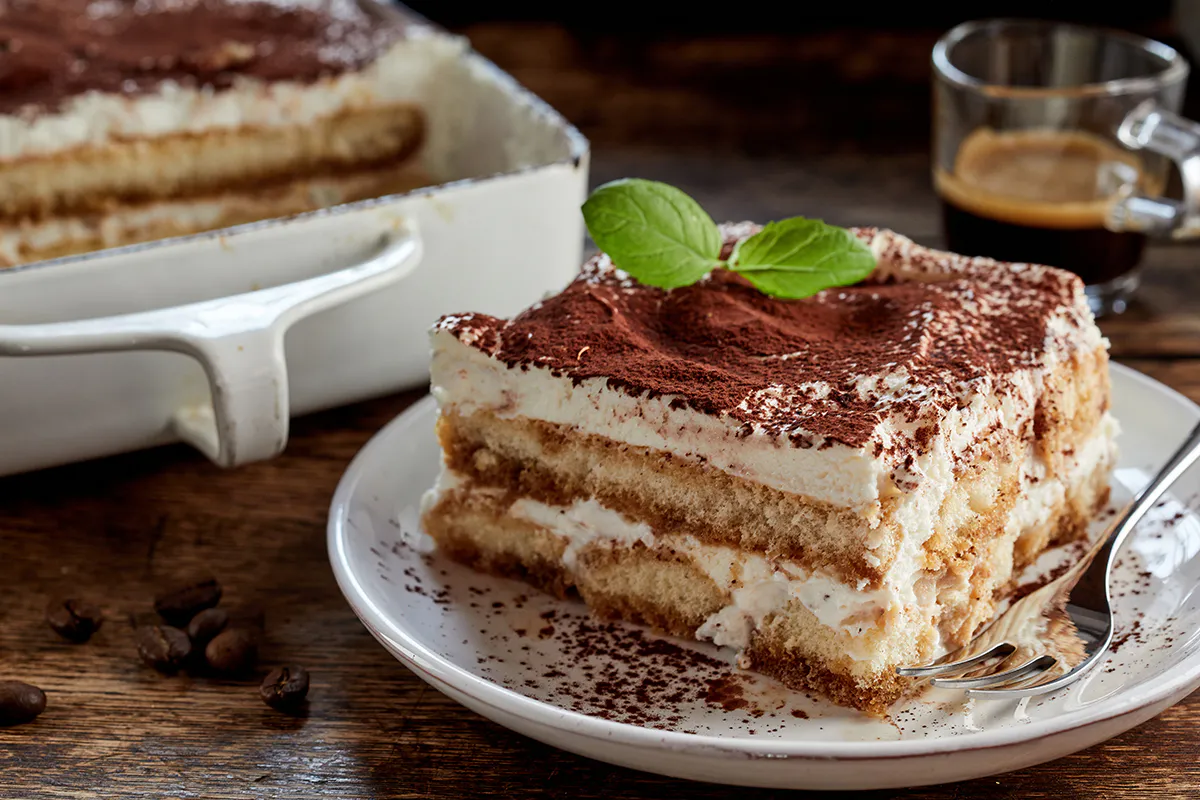 Classic tiramisu slice with cocoa at Sweet Mousse, a Dessert shop in Philadelphia