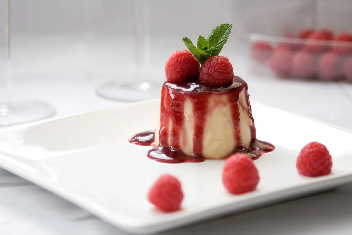 Raspberry panna cotta with berry sauce at Sweet Mousse, a Dessert shop in Philadelphia